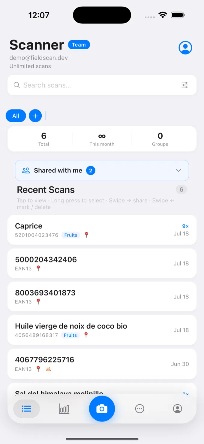 The FieldScan iPhone app showing a list of scanned items, each with its barcode, name and status.